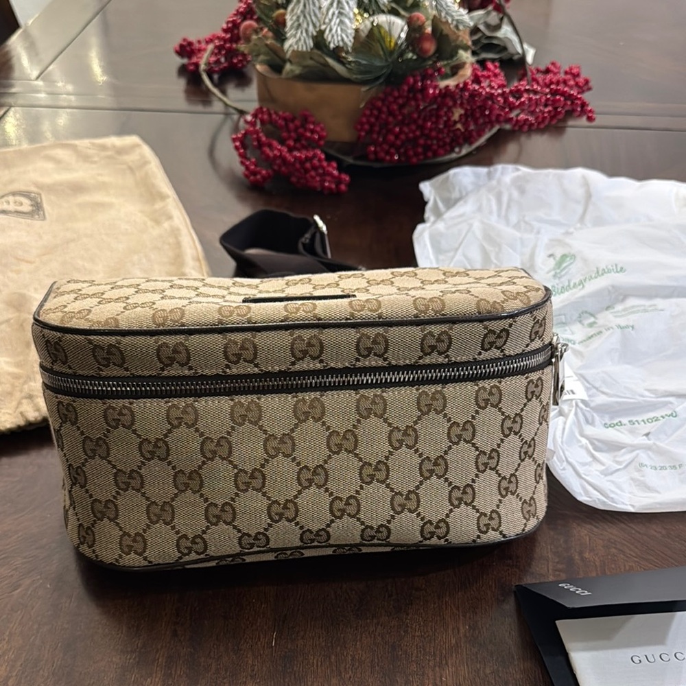 Gucci Cream Belt Bag with Monogram Pattern and Zipper Closure